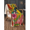 Plaid velours PAJARO 140 x 190 cm jeté sur un fauteuil