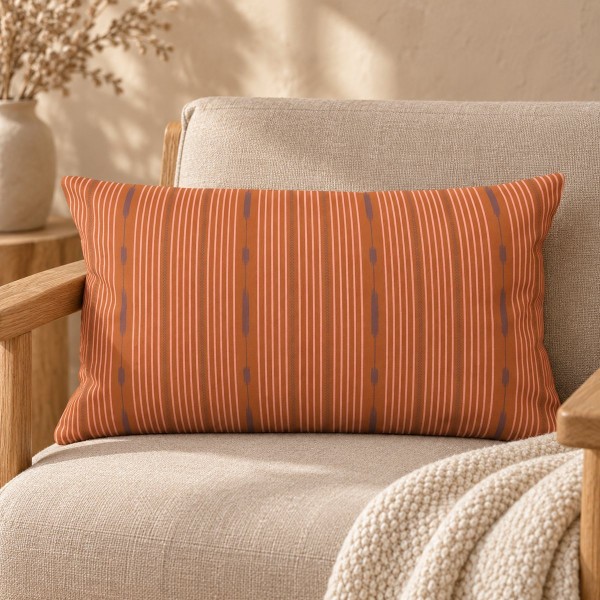 Funda de cojín rectangular PALOMA naranja 30 x 50 cm con relleno, sobre un sillón