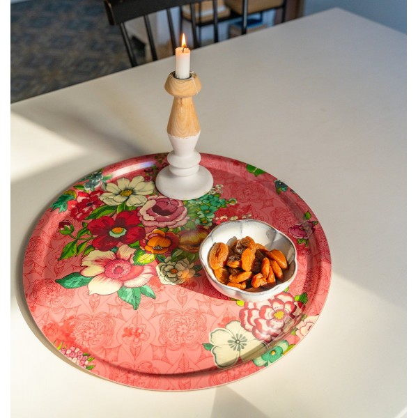 Round tray HANAMI pink Ø 45 cm with a bowl of dried fruit and a candlestick