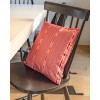 PALOMA pink square cushion cover 40 x 40 cm, filled, on a wooden chair