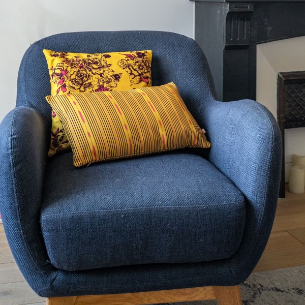 PALOMA yellow rectangular scatter cushion 30 x 50 cm on a blue armchair with another cushion from the collection
