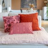 PALOMA pink rectangular scatter cushion 30 x 50 cm on a sofa with other cushions from the collection