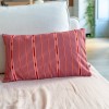 PALOMA pink rectangular scatter cushion 30 x 50 cm on a sofa