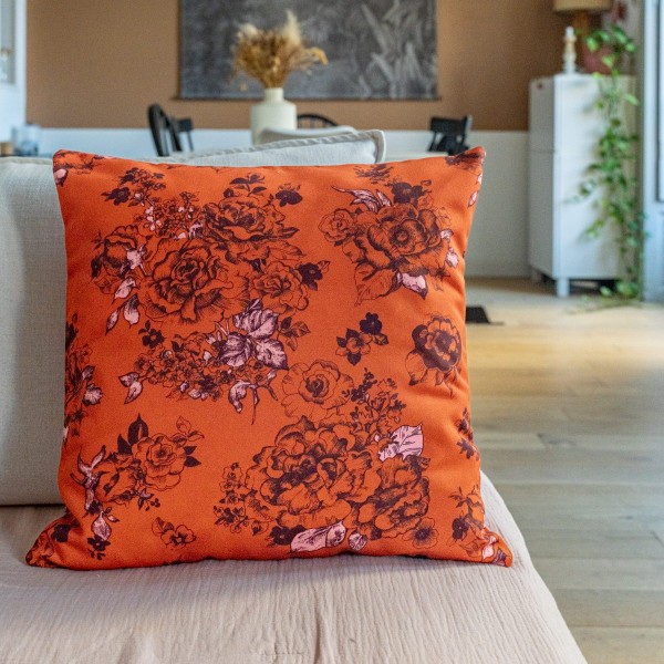 AIMI orange square scatter cushion 40 x 40 cm on a sofa